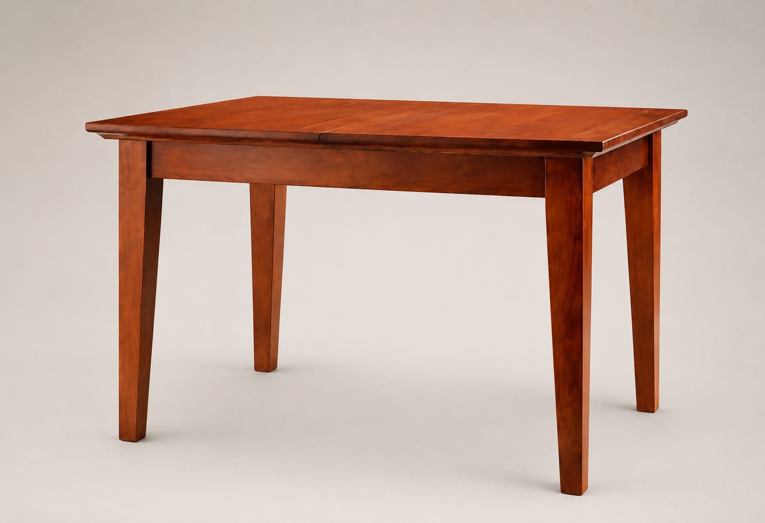"Willis Gambier Originals New York extending dining table in a mahogany finish, featuring a solid birch and veneer rectangular top