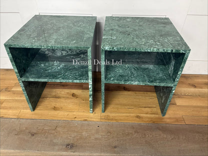A pair of minimalist green marble Anthropologie Gia side tables with an open-base silhouette, positioned symmetrical to frame a living room setup