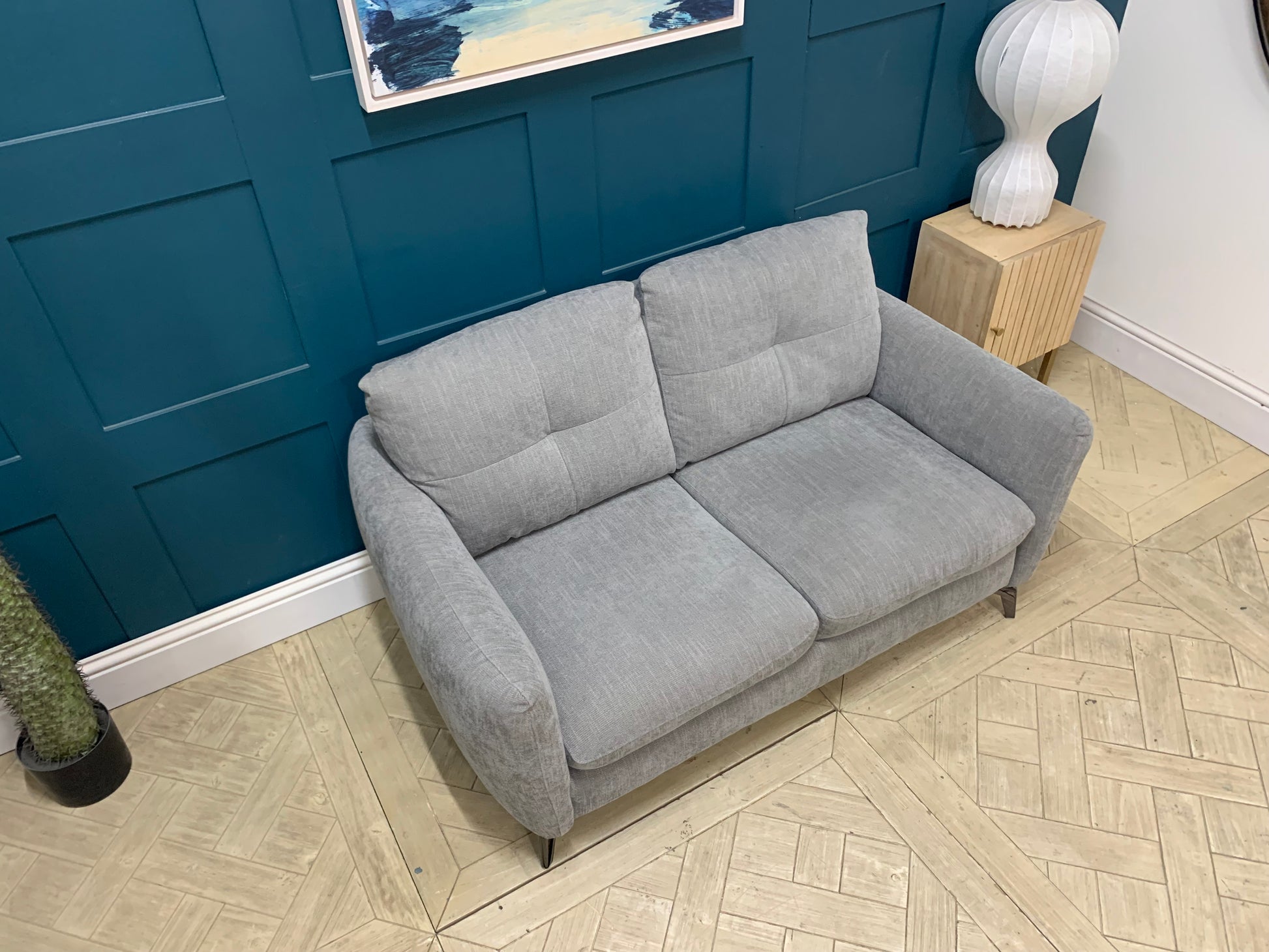 Detail of grey mix cross weave fabric upholstery on the Sofology Mimi 2 seater sofa.