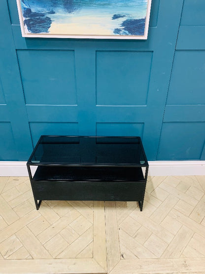 Black stain mango wood TV stand with smoked glass and single drawer.