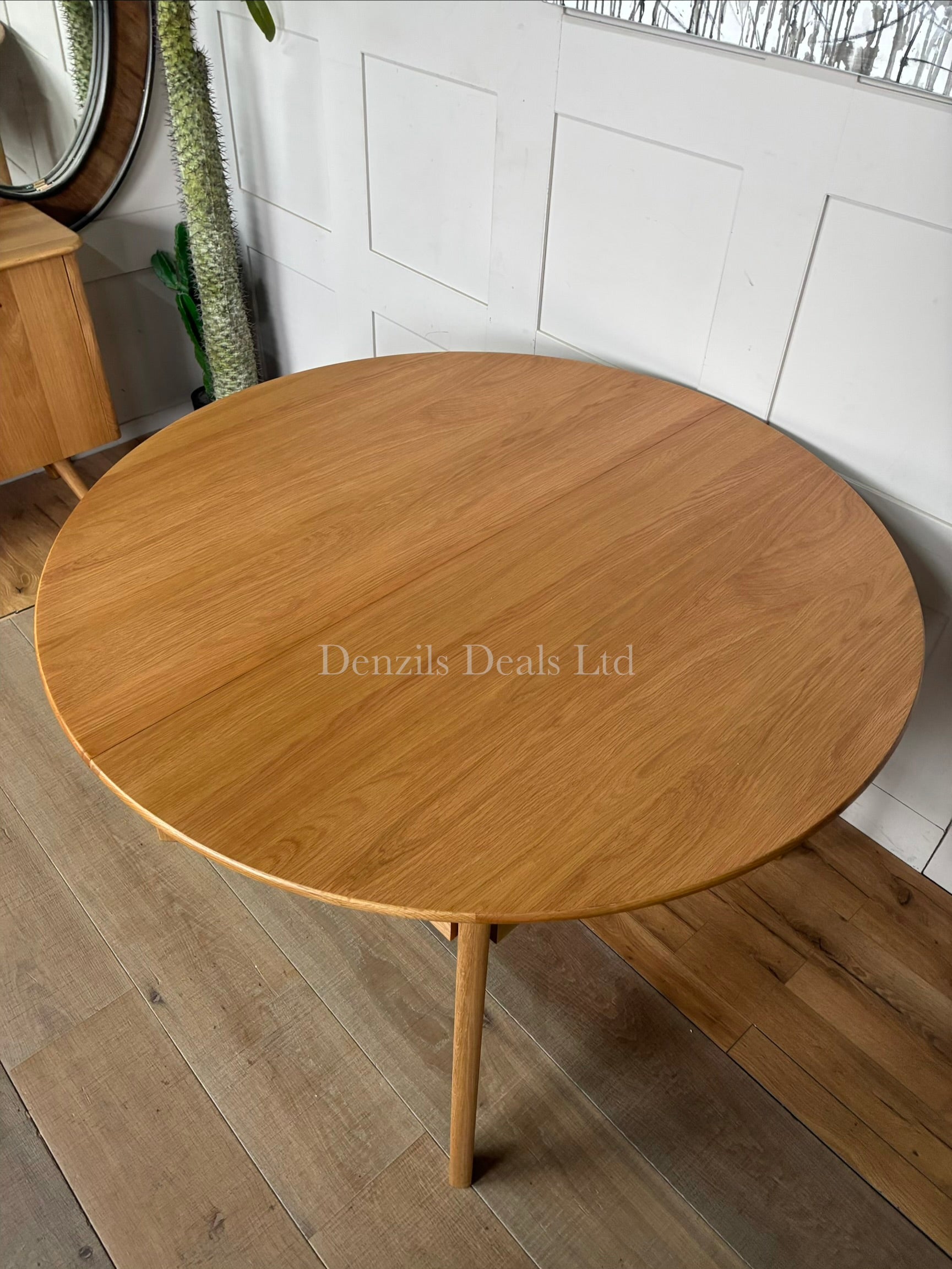 Fishe and Lilly Wright round extendable dining table made from solid light oak wood