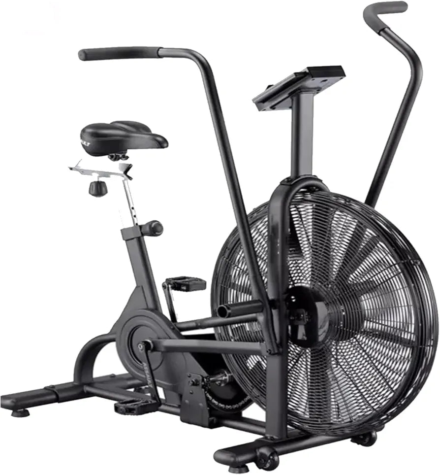 Side profile of a stationary air resistance bike featuring moving dual-action arm handles, a large front fan wheel, and an adjustable padded seat. The unit includes a clear LCD display panel and textured foot pegs on a heavy-duty steel frame.