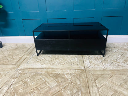 Kilby storage coffee table with two drawers, black mango wood base, and smoked glass surface. With metal frame legs