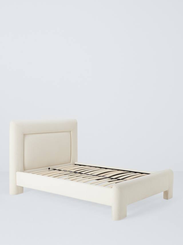 Close-up of the modern, wide headboard with curved edges on the John Lewis Blocky super king bed frame, upholstered in a plush, on-trend white bouclé fabric